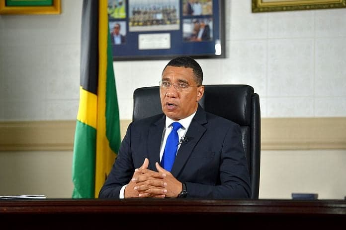 Holness urges landowners to sell unused property to government