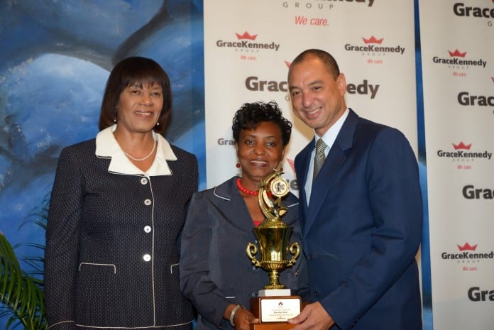 (From left) Prime Minister Portia Simpson-miller, Rosetta Steer and GraceKennedy Group CEP Don Wehby