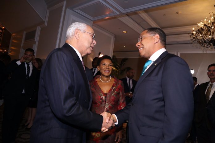 colin powell with Andrew Holness