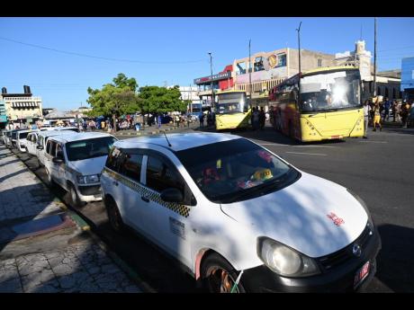 Jamaican taxi and bus operators back on the road after strike