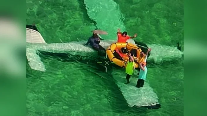 US Coast Guard rescued five people from sea while sitting on the wing of crashed airplane