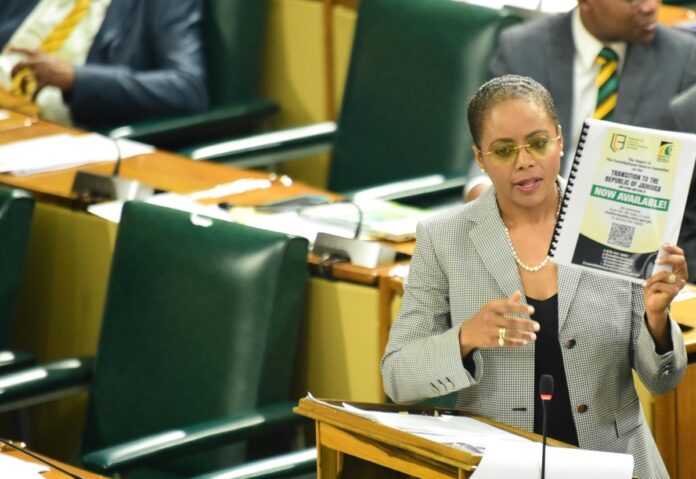 Minister of Legal and Constitutional Affairs, Hon. Marlene Malahoo Forte, displays a copy of the report of the Constitutional Reform Committee (CRC) during her contribution to the 2024/25 Sectoral Debate in the House of Representatives on Tuesday (June 11).