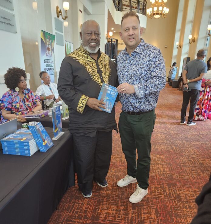 Curtis Myrie with Consul General Oliver Mair at the Jamaica Brew event