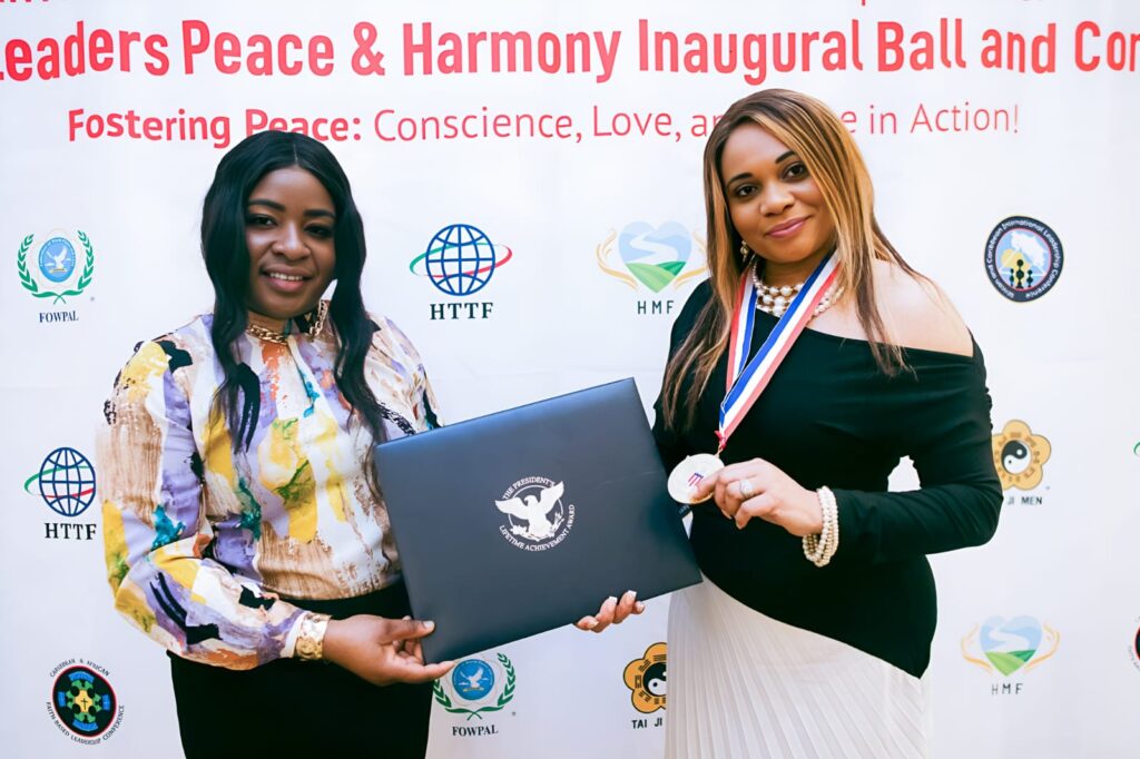 Reverend Marie Berbick celebrates her award with Akelia Thompson, Social Media Manager, Marie Berbick Ministries International.Photo courtesy of Marie Berbick Ministries International